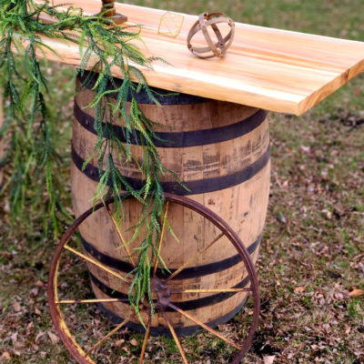 whiskey barrels and table